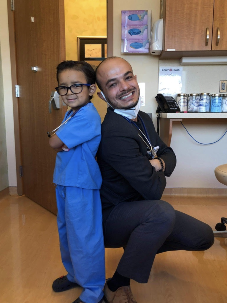 Dr. Waseem from Cure 4 The Kids Foundation with a pediatric cancer patient